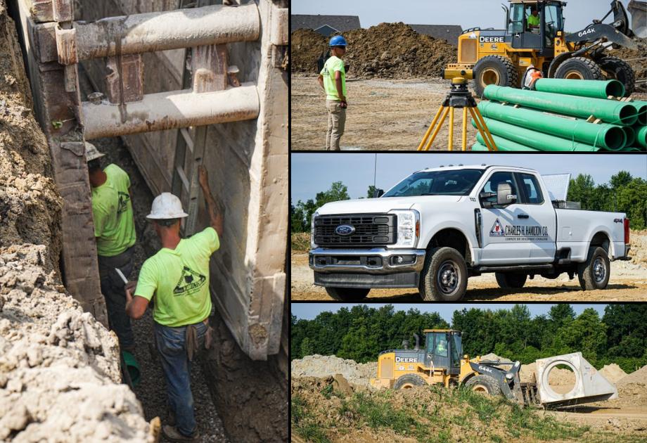 Workers putting piping in, white truck, and bull dozer. 